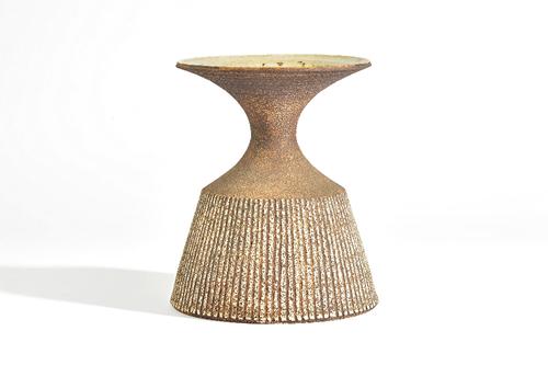Waistel Cooper ( 1921-2003), a stoneware vase or lamp base, the sides incised with vertical lines beneath a waisted neck and everted rim, signed, 22.7