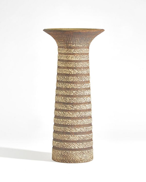 Waistel Cooper ( 1921-2003), a tall stoneware vase, almost cylindrical form with everted rim, the textured body with horizontal bands, signed, 42cm. h