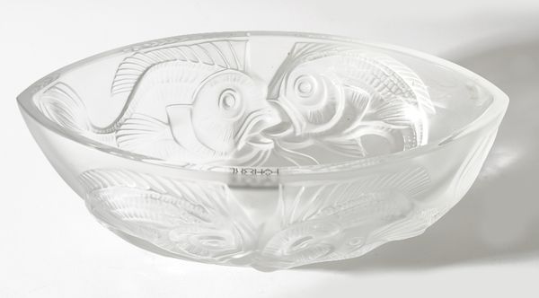 A modern Lalique clear and frosted crystal bowl, relief moulded with fish against a 'Navette' shaped ground, Etched 'Lalique France', 29cm wide.