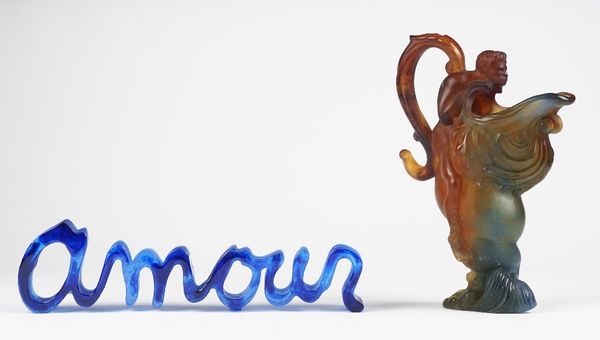 A Daum blue glass 'Amour' sculpture, Ltd edition 15/175, signed, 38cm wide; and a Daum coloured glass ewer moulded with Neptune on top of a mythologic