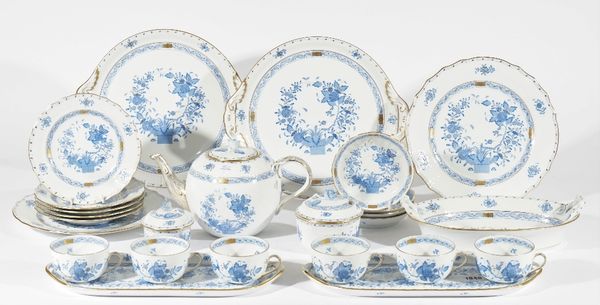 A Herend porcelain part tea service deocrated in the blue Chinese bouquet pattern, comprising; a teapot and cover (15cm high), two graduated sucrier a