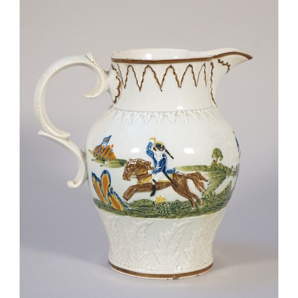 A Prattware pottery jug, circa 1800, relief moulded and typically coloured with soldiers on horseback, one probably representing the Duke of York, 19.