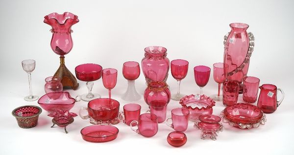 A group of cranberry glass, late 19th century, including; vases, bowls, dishes, a milk jug and various drinking glasses, (28).