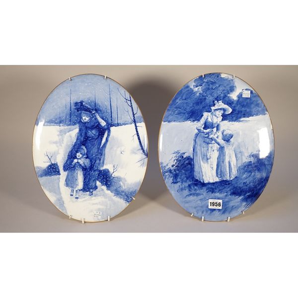 A pair of large Doulton Burslem `Blue Children' oval plaques, circa 1900, each decorated with a mother and child in a landscape, printed Doulton Bursl