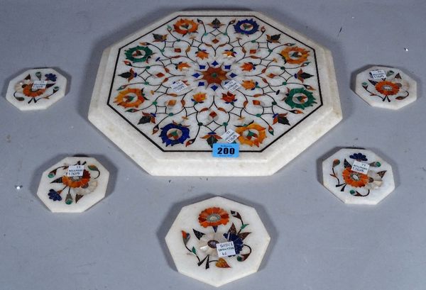 A marble and specimen stone inlaid octagonal table mat and five similar coasters, (6).  S5M