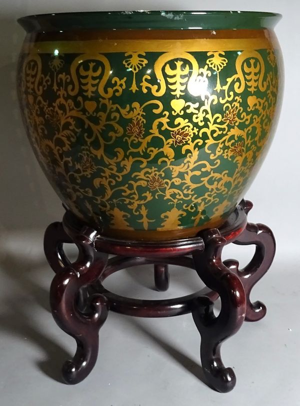 A 20th century ceramic jardiniere with gold foliate decoration on a hardwood stand, 42cm wide x 68cm high.  C5