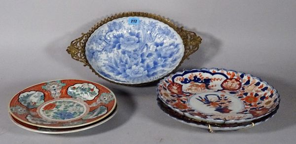 A Chinese blue and white gilt metal mounted oval bowl, two Imari decorated plates and two Chinese famille verte decorated plates, (5).  S5T