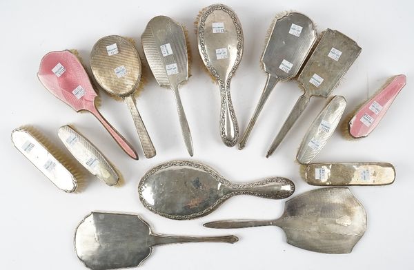 A silver and pink enamel mounted hairbrush and a matching clothes brush, Birmingham 1934 and a group of mostly silver mounted dressing table wares, co