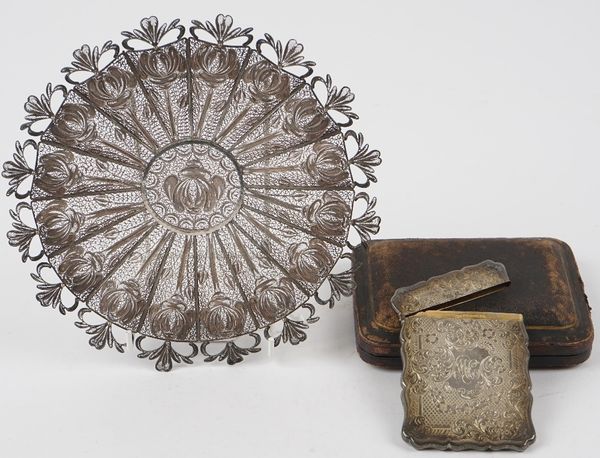 A silver shaped rectangular visiting card case, with floral, foliate and scroll engraved decoration, monogram engraved, maker George Unite, Birmingham