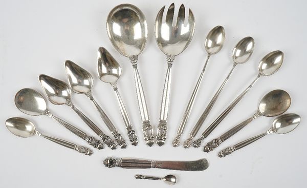 Fourteen pieces of Georg Jensen acorn pattern Sterling silver table flatware, comprising; three sundae spoons, a pair of servers, three grapefruit spo