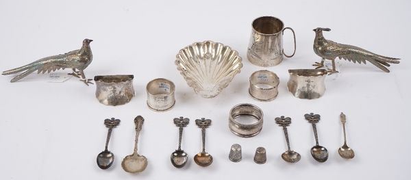 Silver, comprising; a christening mug engraved with fern sprays, Birmingham 1906, a buttershell, a pair of napkin rings, Sheffield 1902, three further