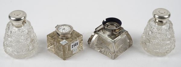 A silver mounted square glass inkwell, Birmingham 1911, the top mounted with a keyless wind, openfaced fob watch, another silver mounted glass inkwell