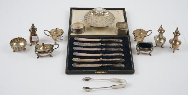 Silver and silver mounted wares, comprising; a butter shell, London 1918, a pair of mustard pots, Chester 1912, having blue glass liners, a pair of pe