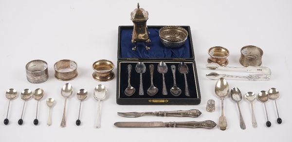 Silver, comprising; a set of six teaspoons, with a case, a set of six coffee spoons with black bean finials to the handles, six various spoons, a pair