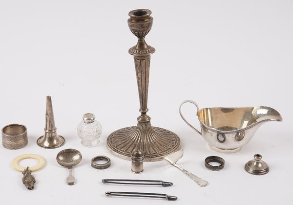 Silver and silver mounted wares, comprising; a sauceboat having a decorated rim, Sheffield 1935, a fiddle pattern tea caddy spoon, with engraved decor