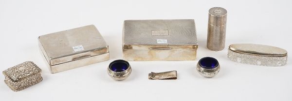 Silver and silver mounted wares, comprising; two rectangular table cigarette boxes, wooden lined within, a money clip, a shaving stick holder, a recta