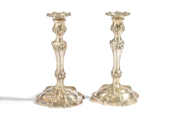 A Belgian pair of table candlesticks, each of cast form, decorated in the Rococo taste, having detachable sconces, detailed A835, height 26cm, combine