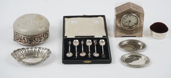 Silver and silver mounted wares, comprising; a small mantel clock, the circular silvered dial with black Arabic numerals, Birmingham 1929, a circular