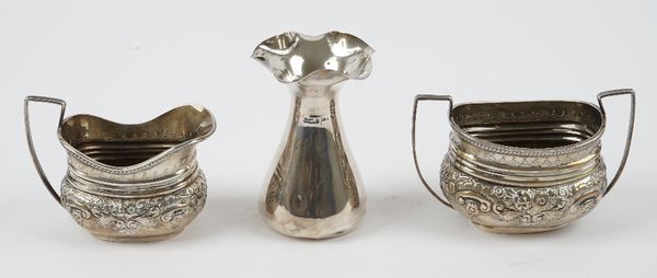 Silver, comprising; a milk jug and a matching twin handled sugar bowl, each with floral embossed decoration, London 1896 and a vase, of tapered form,