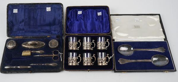 Silver and silver mounted wares, comprising; a pair of trefid end rat tail pattern Britannia Standard serving spoons, London 1905, a set of six liqueu