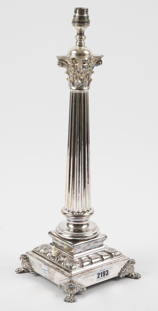 A silver plated table lamp,designed as a Corinthian column, raised on a square base having four paw corner feet, height 49cm.