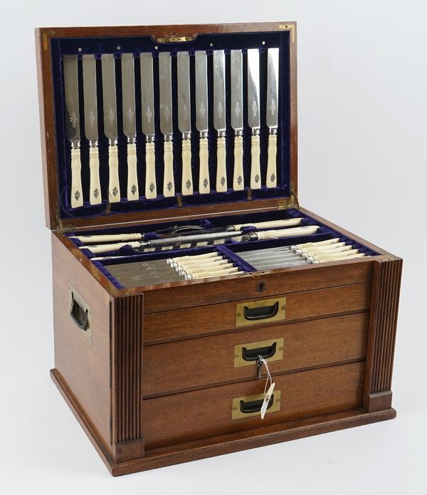 A late Victorian silver, Old English pattern table service; comprising; twelve table spoons, twelve dessert spoons, one soup ladle, two sauce ladles,