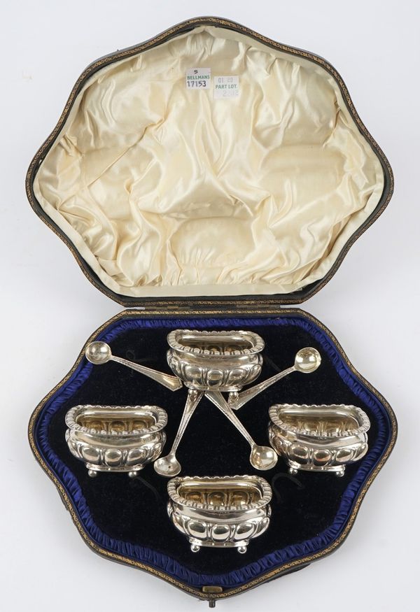 A set of four silver salts, each with lobed decoration, raised on four spherical feet, Sheffield 1903 and a set of four silver salt spoons, Sheffield