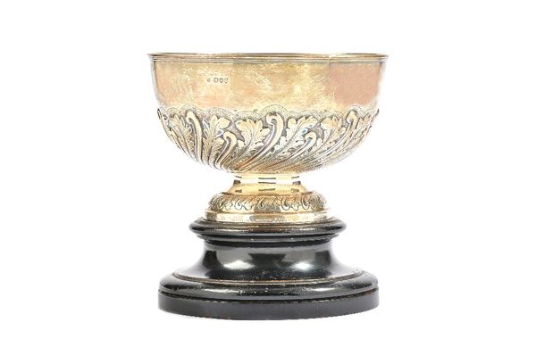 A Victorian silver rose bowl, the body with foliate and spiral fluted decoration above a decorated circular foot, diameter 19.3cm, London 1894, weight