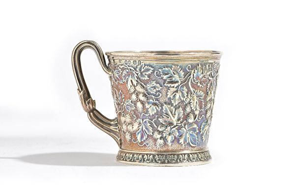 A George IV Paul Storr silver mug, of tapered cylindrical form, the body decorated with fruiting vine and with a rustic handle, raised on a decorated