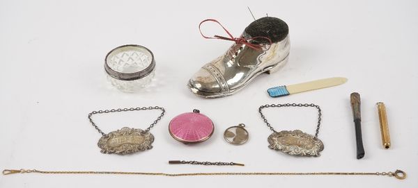 A silver mounted pin cushion, modelled as a gentleman's shoe, with an oak underside, Birmingham 1926, length 12.5cm, two silver decanter labels, detai