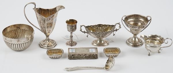 A group of silver comprising; a milk jug, Chester 1898, a Victorian bowl, with partly fluted decoration, London 1884, a Holy Communion chalice, Birmin