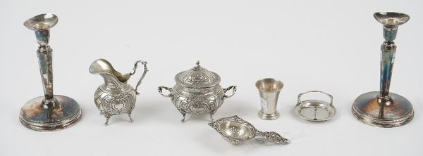 A group of Swedish silver, comprising; a pair of candlesticks, each with an octagonal tapered stem, raised on a circular foot (loaded), height 14.5cm,