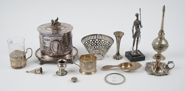 A group of plated and foreign wares, including; a strainer, probably Persian, a tea glass holder, probably Persian, a plated oval biscuit box, the hin