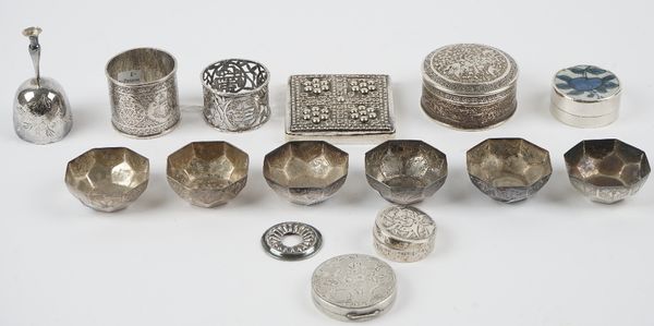 A group of mostly Asian wares, comprising; four circular boxes, six octagonal small dishes, two napkin rings, a cup, (the base detached, but present)