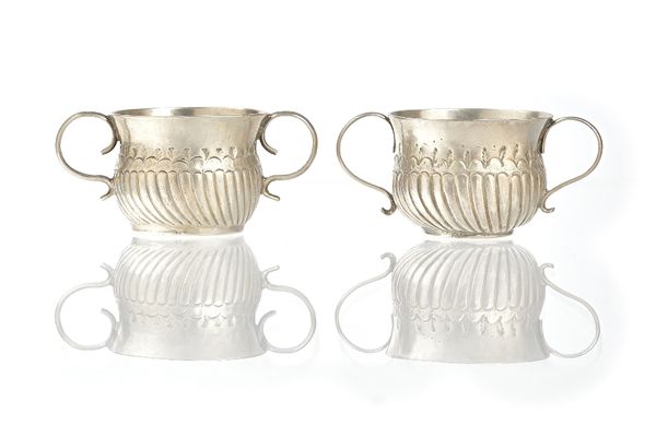 A Britannia Standard silver twin handled miniature porringer, with partly fluted decoration, makers mark probably CO, London possibly 1701, diameter 4