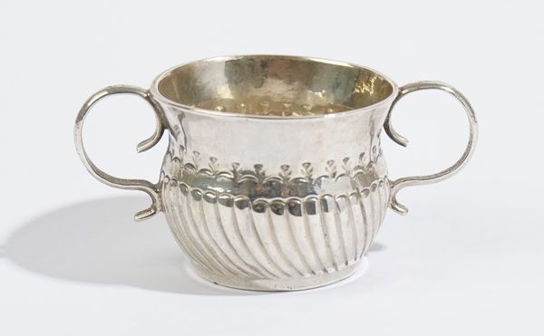 A George I Britannia Standard silver miniature twin handled porringer, the body with partly fluted decoration, diameter 4cm, London 1716, maker Willia