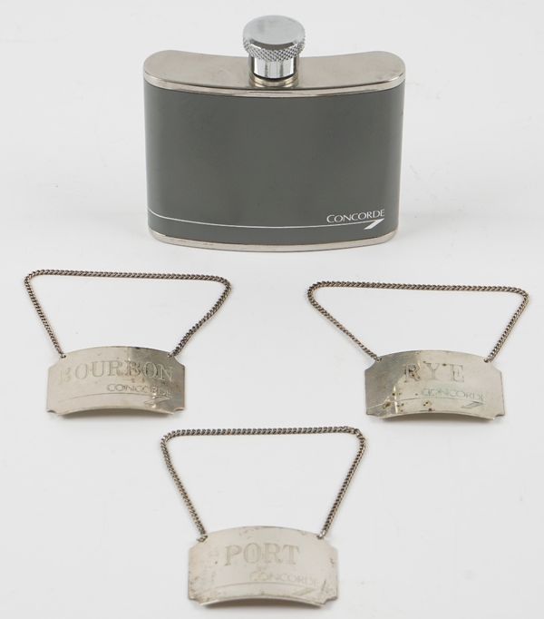 A small group of Concorde interest items, comprising; three silver decanter labels, comprising; Bourbon, Rye and Port, Birmingham 1986 and a grey leat