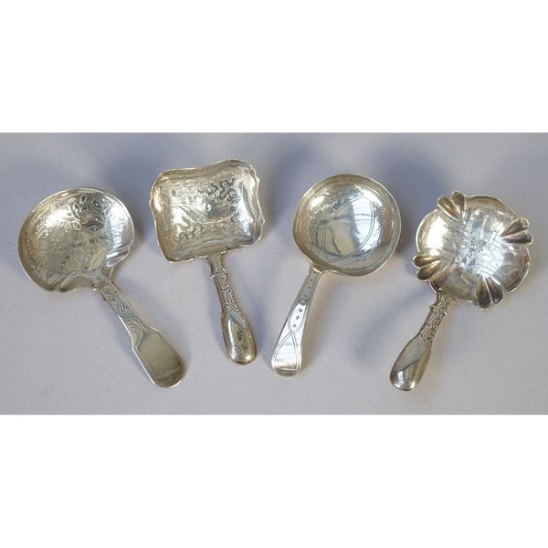 A Victorian silver tea caddy spoon, with foliate decoration to the bowl and to the handle, Birmingham 1849 and three further silver tea caddy spoons,