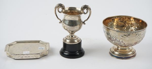 Silver and silver mounted wares, comprising; a circular pedestal bowl, with embossed floral, foliate and scrolling decoration, Birmingham 1909, diamet