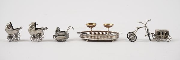 A group of mostly silver miniatures, comprising, an oval twin handled gallery tray, having an oak base, Birmingham 1907, two champagne coupes, Birming