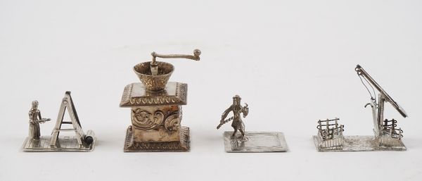 A silver model of a miniature coffee grinder, import mark London 1900 and three mostly Dutch miniatures, comprising; a canal bridge, a carpet beater a