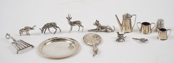 A group of mostly silver miniature wears, comprising; six models of animals, including a bird, a trivet, a hand mirror detailed 925, a thimble, a comp