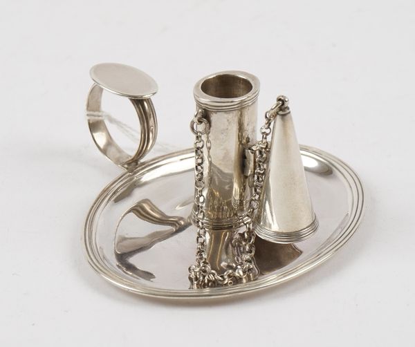 A George III silver chamber candlestick, of oval form, decorated with reeded bands and with a detachable snuffing cone, fitted to a chain, London 1796