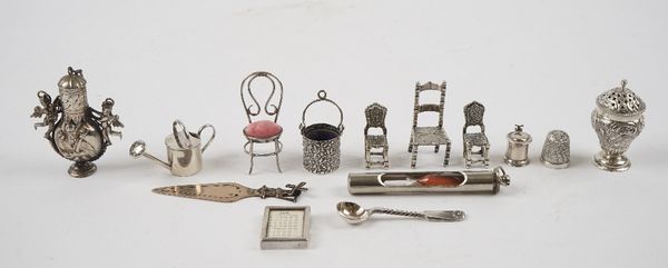 Silver, foreign and plated wares, comprising; a Victorian pepperette with floral, foliate and scroll embossed decoration, Sheffield 1880, a thimble ho