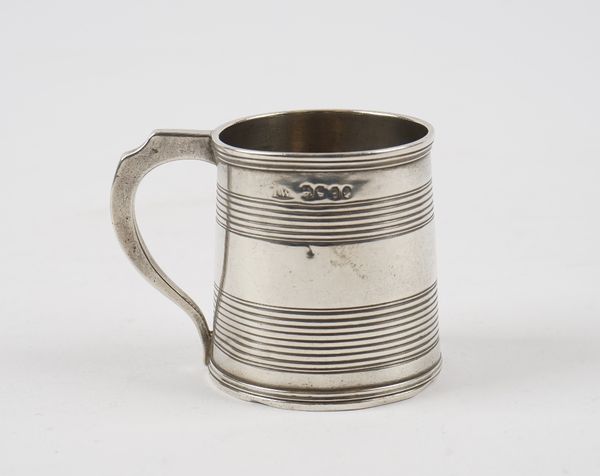 A William IV silver christening mug, of tapered cylindrical form, decorated with reeded bands, London 1834, height 6cm, weight 92 gms.