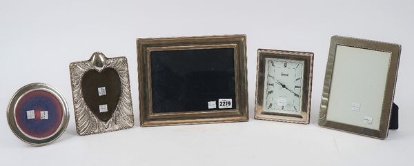 A silver mounted shaped rectangular photograph frame, with embossed fluting and beaded decoration and with a central heart shaped aperture, Birmingham