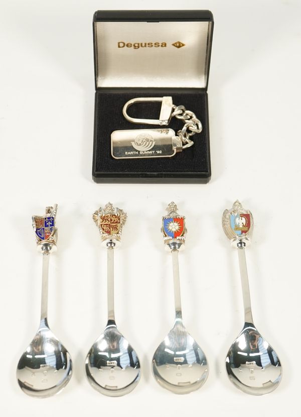 A part set of four silver and enamelled spoons, the finials modelled as four differing models representing The Queen's Beasts, London 1977, sample len