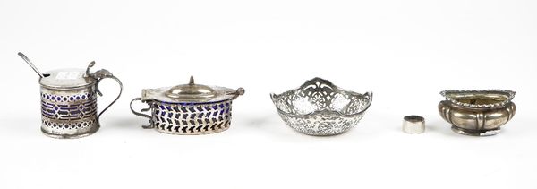 Silver, comprising: a mustard pot Birmingham 1925 with a blue glass liner, a mustard spoon, an oval salt, a small bon bon dish having pierced decorati