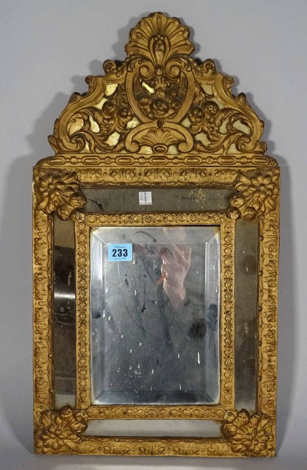 A 19th century gilt brass and bevelled glass cushion shaped wall mirror, 32cm wide x 49cm high. B3