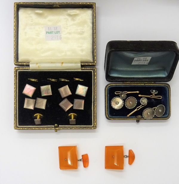 An abalone shell gentleman's dress set, each piece of square form, comprising; four buttons, a pair of cufflinks and a pair of studs, cased, a pair of